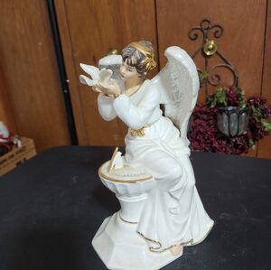 O'WELL EUC PORCELAIN ANGEL FIGURINE WITH DOVE SITTING ON SUNDIAL